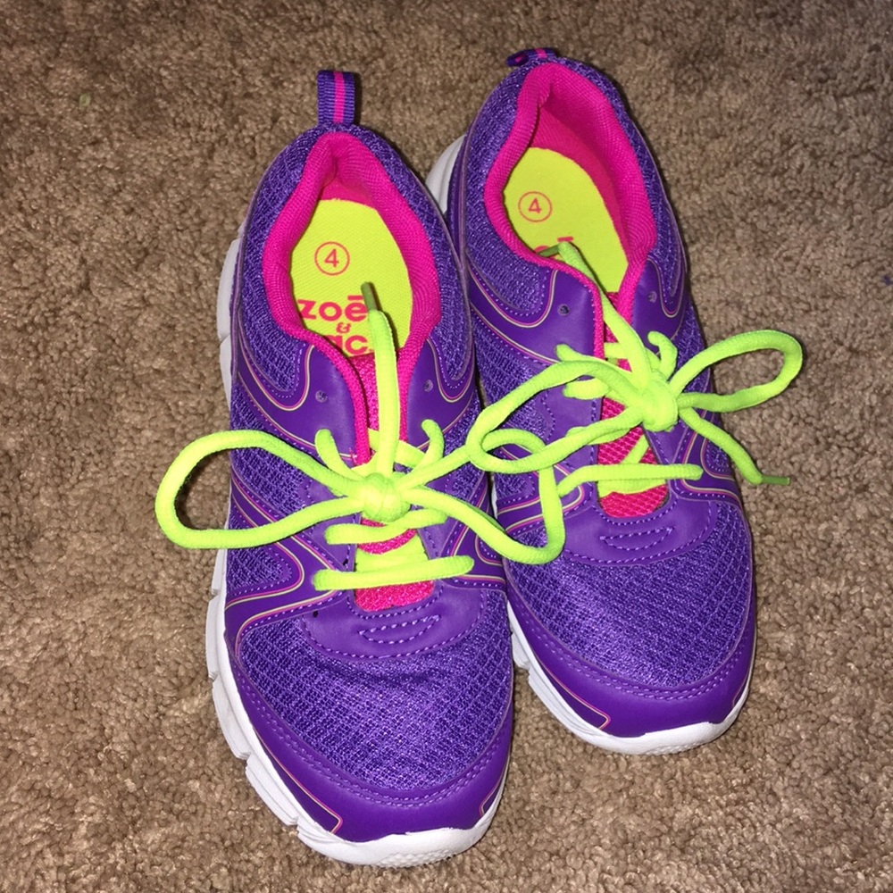 Purple tennis shoes with yellow neon laces!